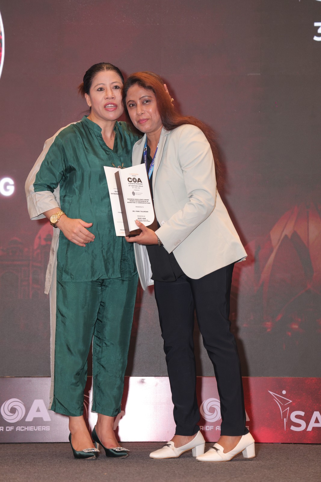 Pinki Talukdar, Ariess Marketing Group Founder has Honoured with Business Excellence Award by Mary Kom